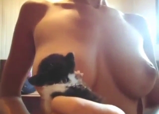 Zoo XXX with a tiny kitty licking her tits hard